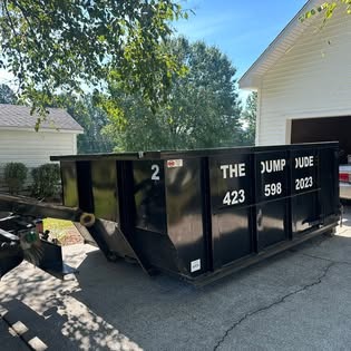 Dumpster in a driveway for a garage cleanout