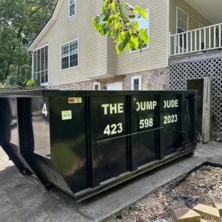 Dumpster beside a home during a renovation